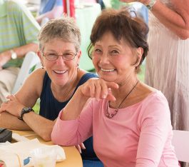 Two woman smiling at camera