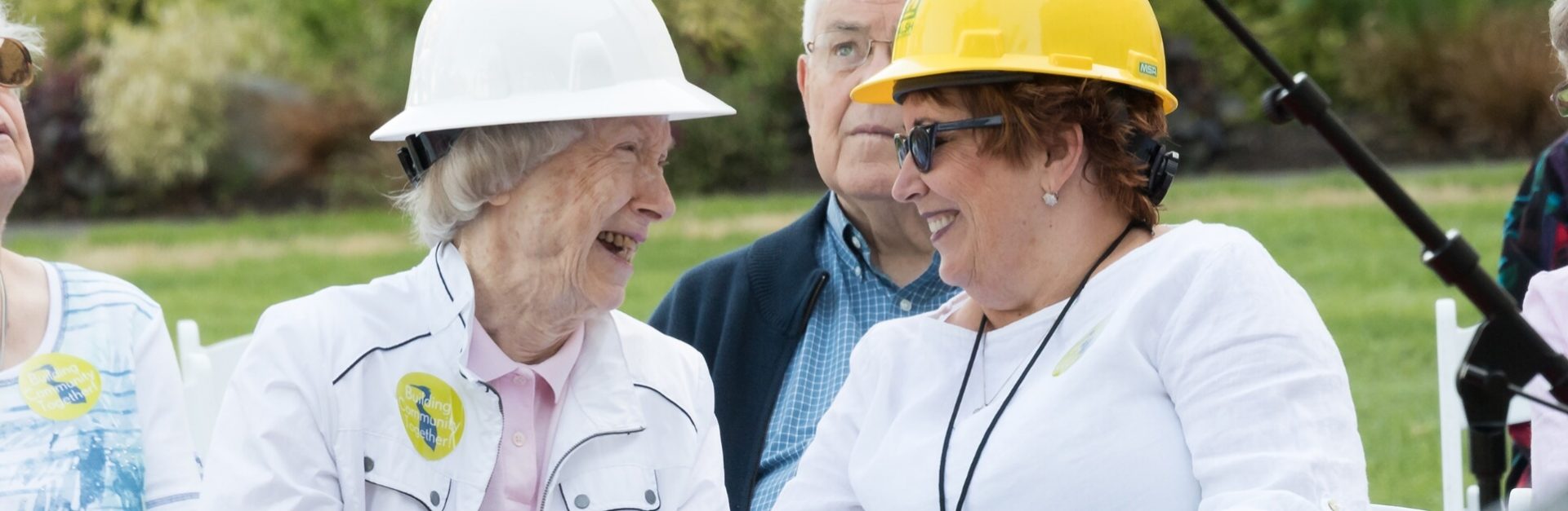 Two women in hard hats at a Blue Heron Foundation event