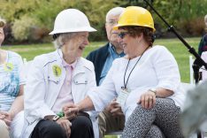 Two women in hard hats at a Blue Heron Foundation event