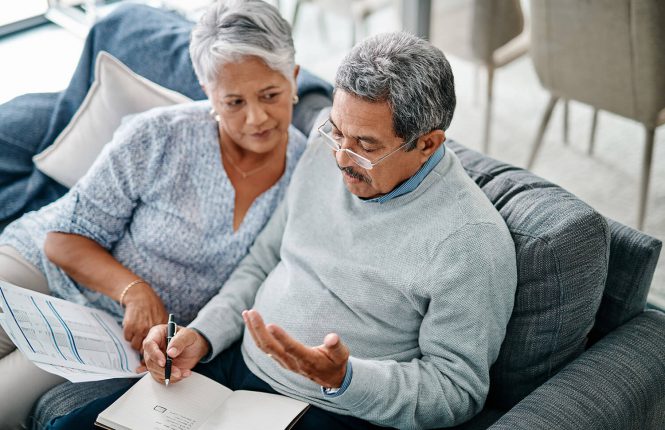 A senior couple reviewing financial decisions together