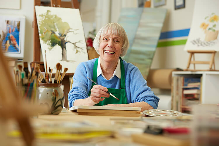 A woman painting in an art studio