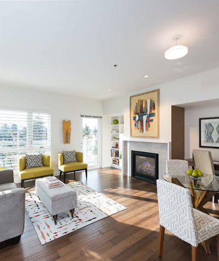 A Balcony Home living and dining area which includes a fireplace and office space