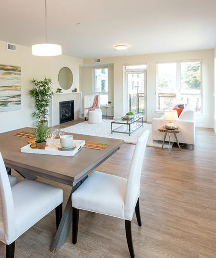 North Pointe home showing dining and living room area with lots of natural light