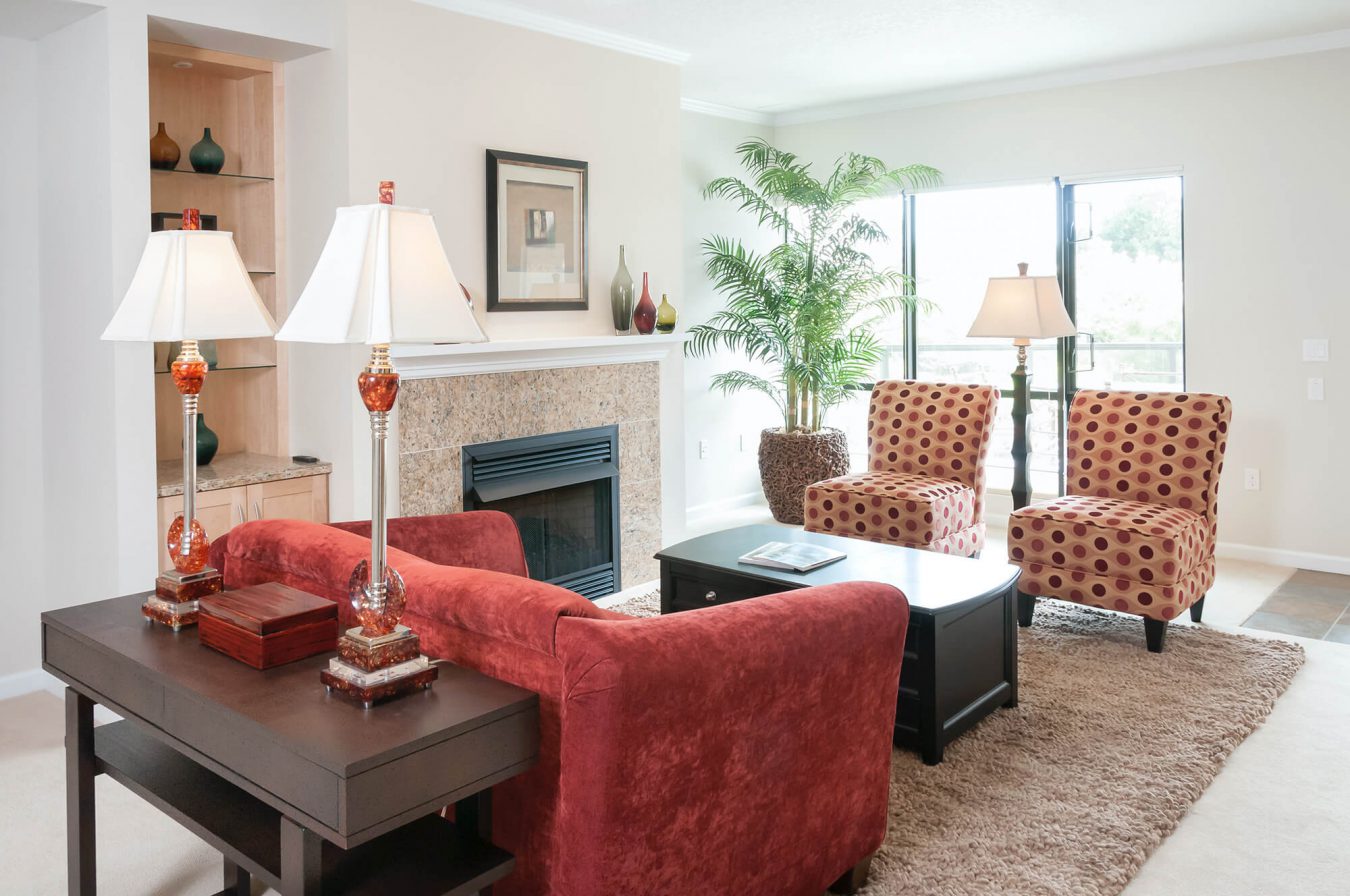 A living room with a fireplace in a Patio Home