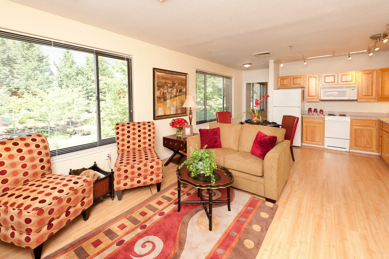 Open living room, dining room and kitchen in a Plaza apartment