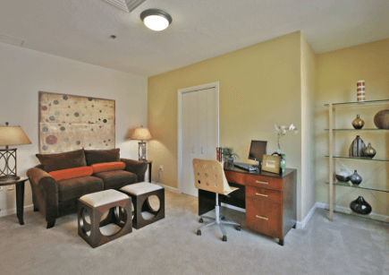 Living space with office desk in a Plaza apartment